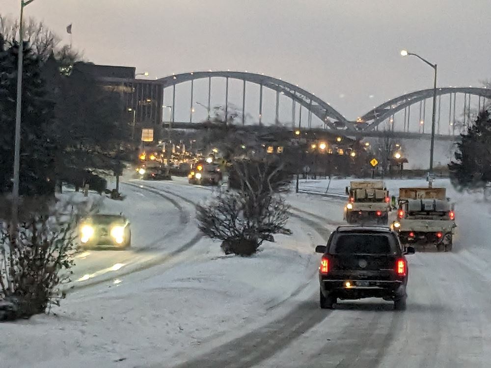Snow Plowing Downtown with Centennial Bridge in Background