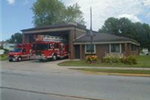 Exterior of Fire Station 3 with parked fire trucks 